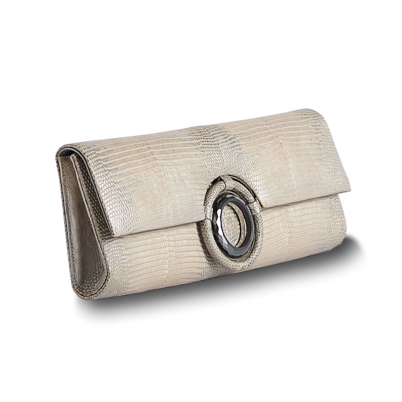 Side view of Champagne Lizard Grommet Roll Clutch - Darby Scott