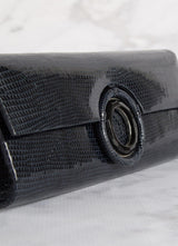 Detail view Black Onyx Grommet Inlay on navy lizard clutch - Darby Scott 