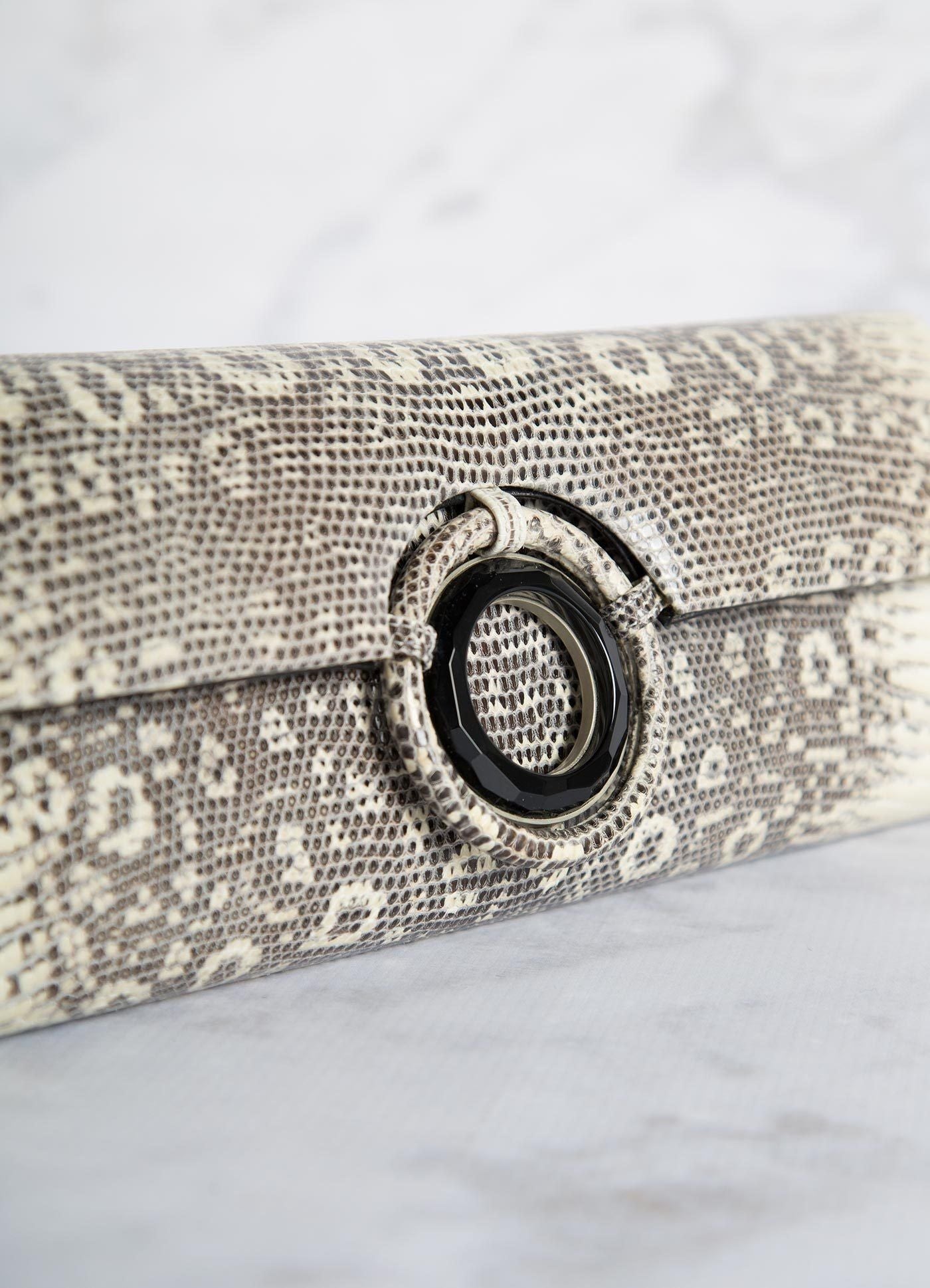 Detail of Black Onyx Grommet on black & white ring lizard clutch - Darby Scott