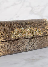 Detail view of Gemstone Embellishment on a Cafe Ring Lizard Clutch - Darby Scott