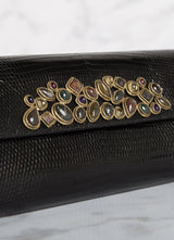 Close up Cabochon Embellishment on a Black Teju Lizard Clutch - Darby Scott