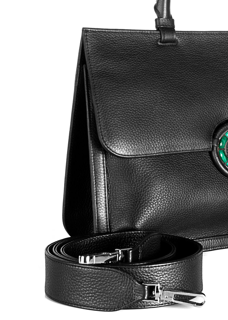 Crossbody strap and side details on black leather grommet saddle bag  - Darby Scott