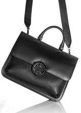 Grommet and Strap detail on black leather grommet saddle bag - Darby Scott