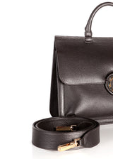 Crossbody strap and detail side of brown leather saddle handbag - Darby Scott