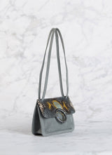 Side view of Denim Suede and Python Mini Saddle Bag - Darby Scott