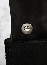 Interior view of handle toggle on black embossed haircalf Shoulder Bag - Darby Scott