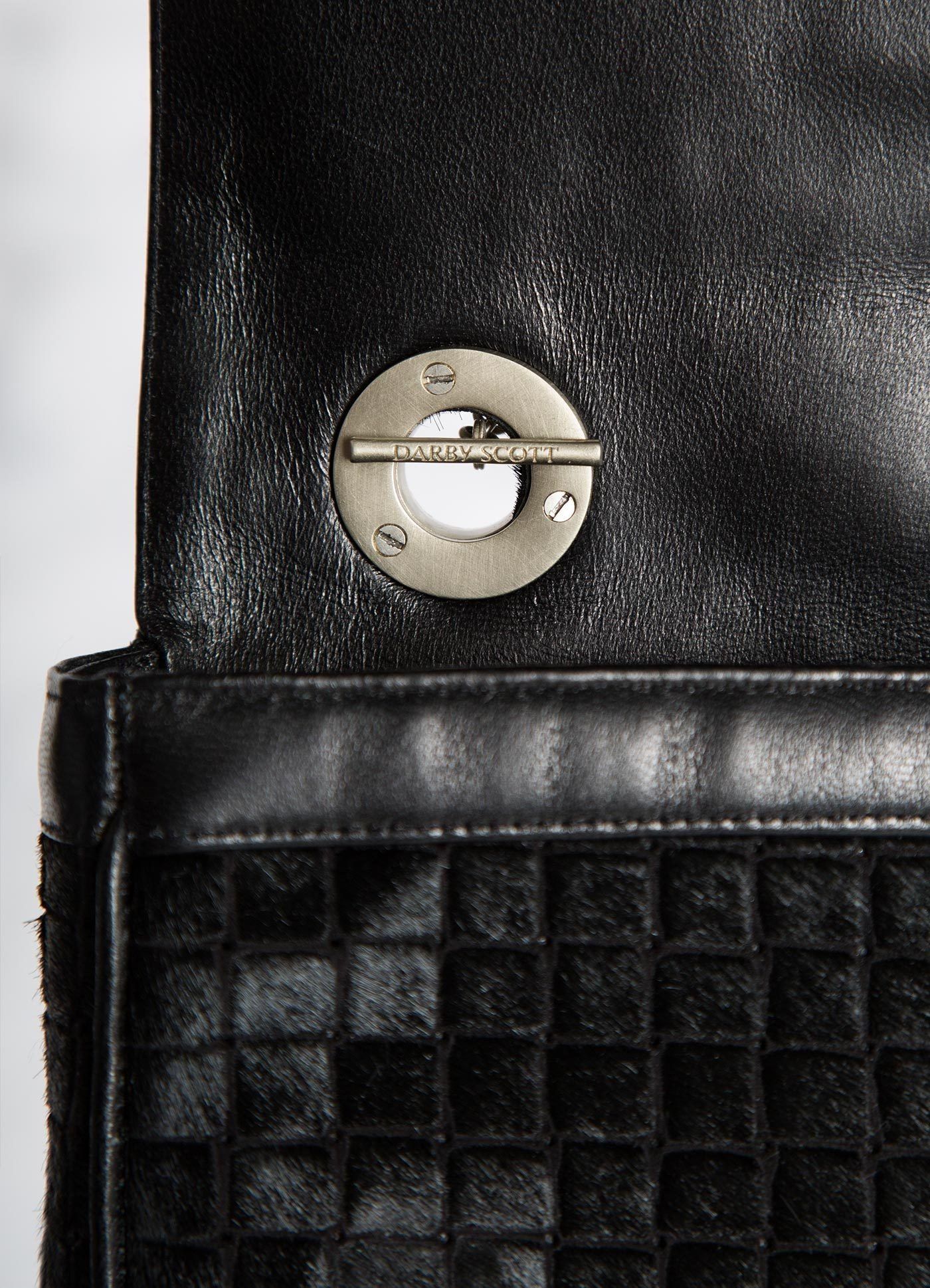 Interior view of handle toggle on black embossed haircalf Shoulder Bag - Darby Scott