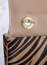 Interior view of handle toggle connector on animal print shoulder bag - Darby Scott