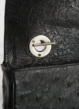 Interior view of handle on toggle black ostrich Shoulder Bag - Darby Scott