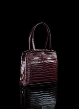 Angled view of Bordeaux Niloticus Crocodile Crawford Tote - Darby Scott