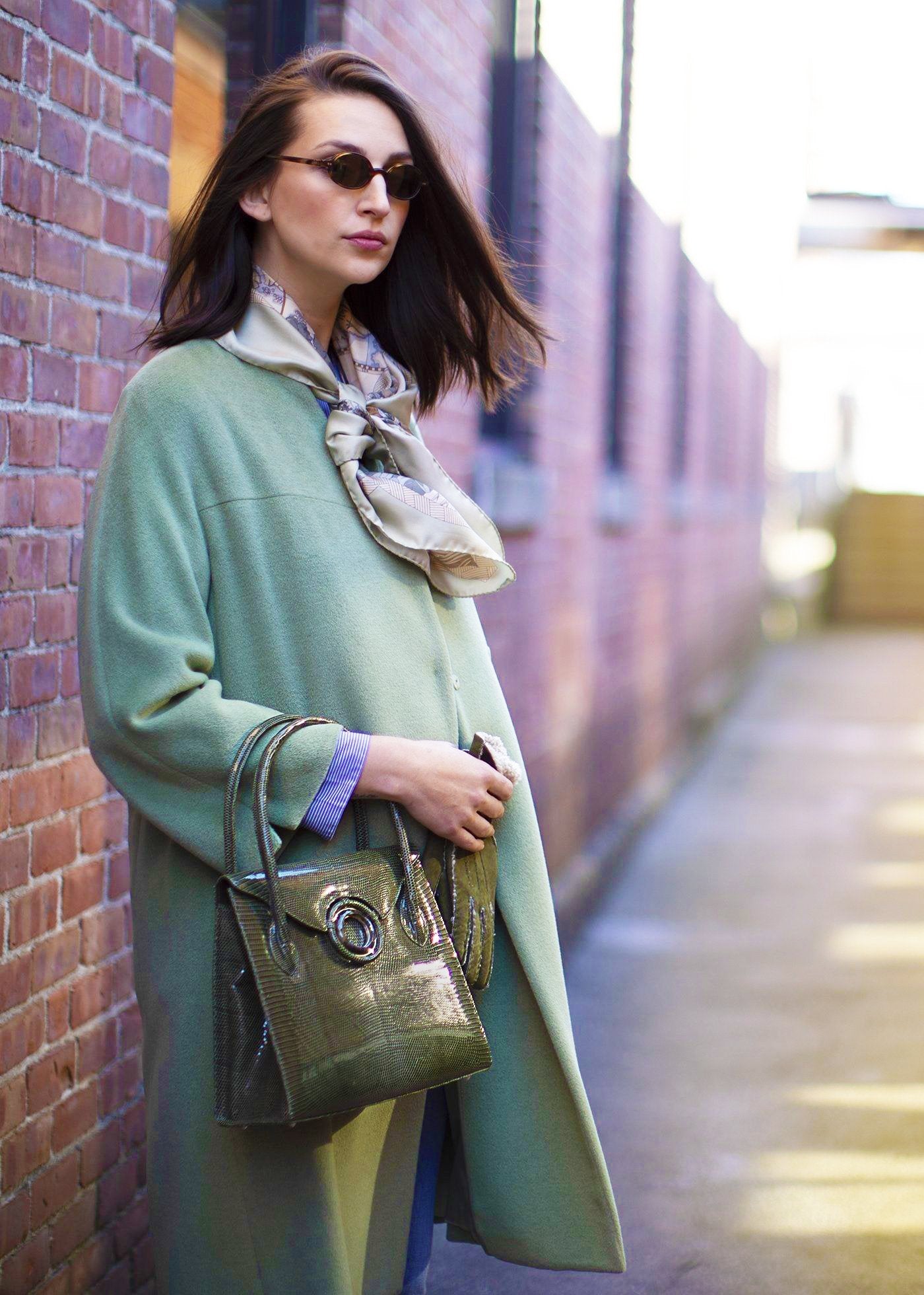 Model carries a Thompson "O" Tote in OIive Lizard - Darby Scott