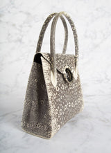 Side of Thompson "O" Tote in Black & White Ring Lizard - Darby Scott