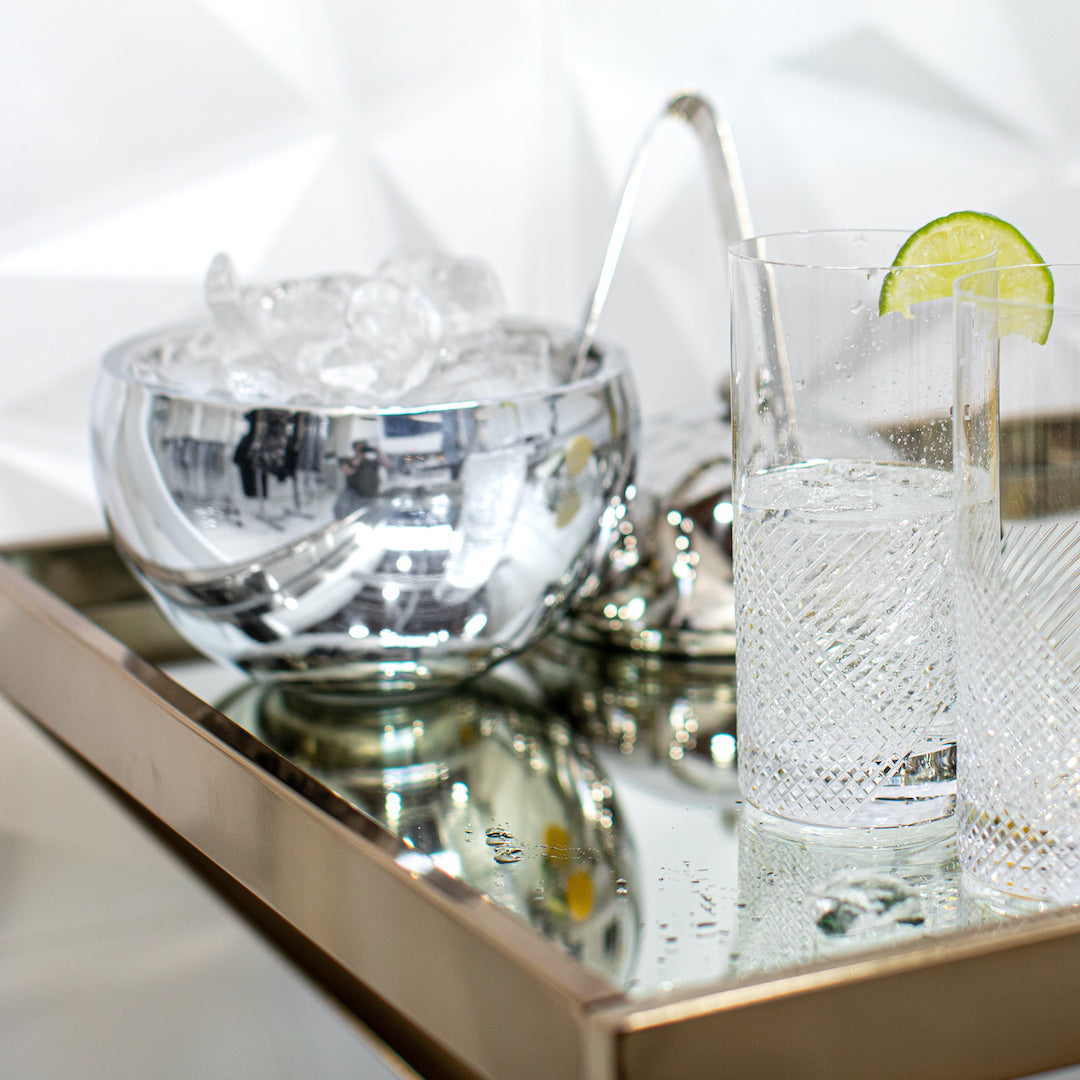 Highball cut glasses and ice bucket on bar cart