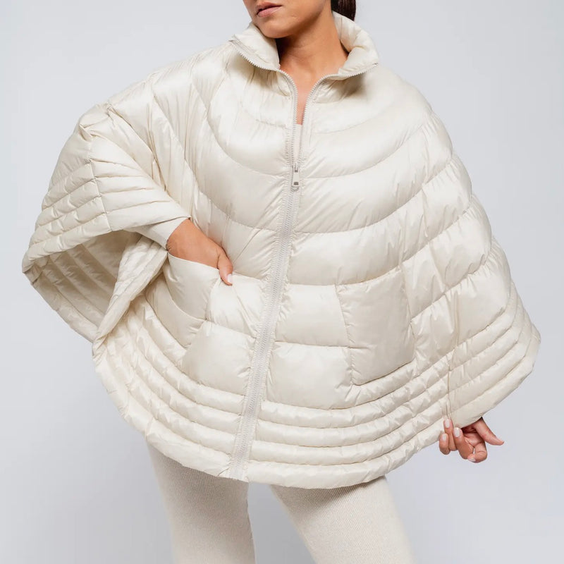 Ivory puffer cape on model