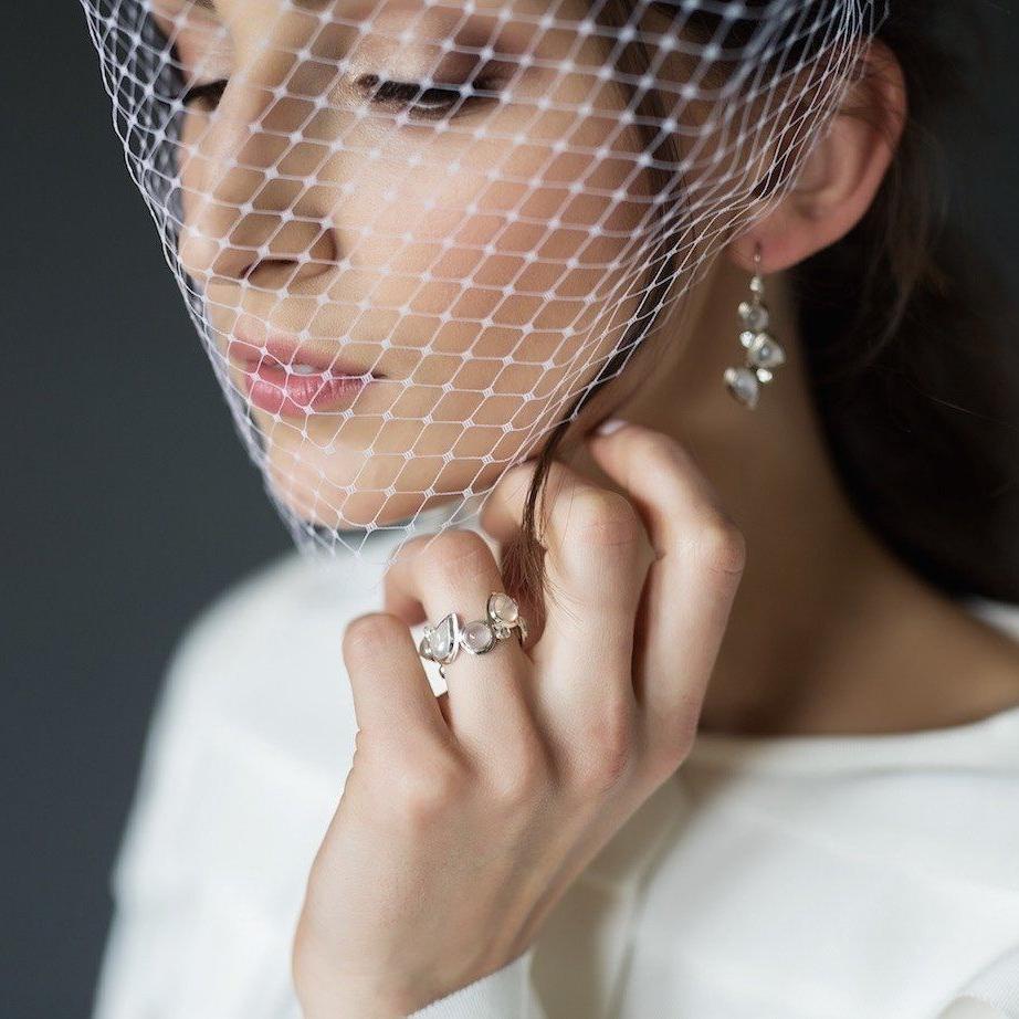 A bride with veil wears Moonstone & Diamond Sterling Mosaic Ring & Earrings - Darby Scott