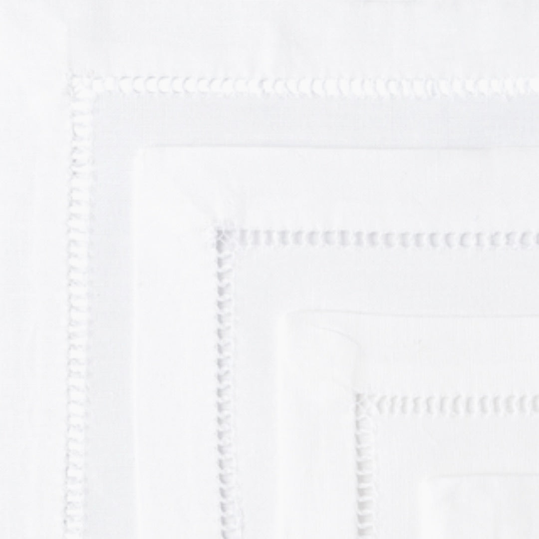 Detail view of hand-stitching edge on cocktail napkins