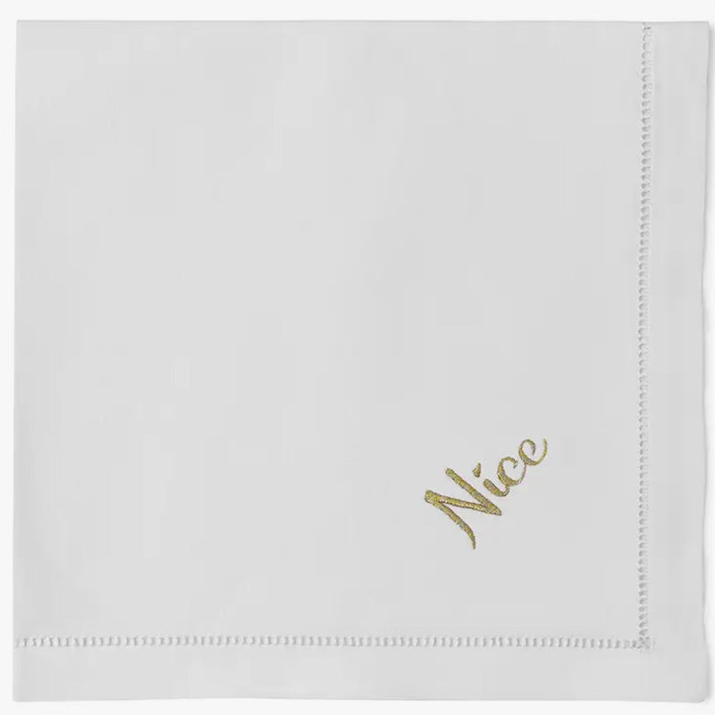 Dinner napkin with 'Nice' embroidered on edge