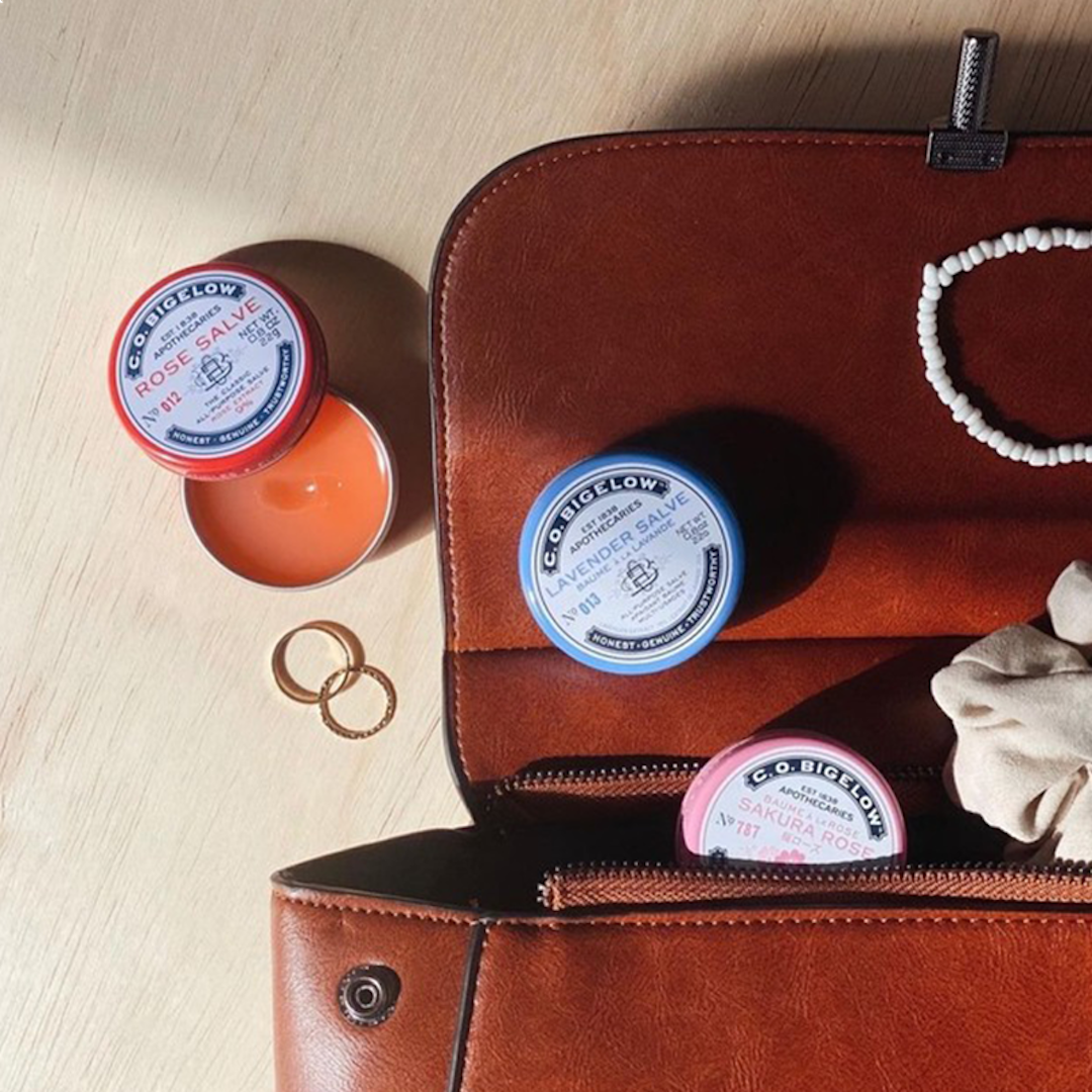 handbag with three salves in it