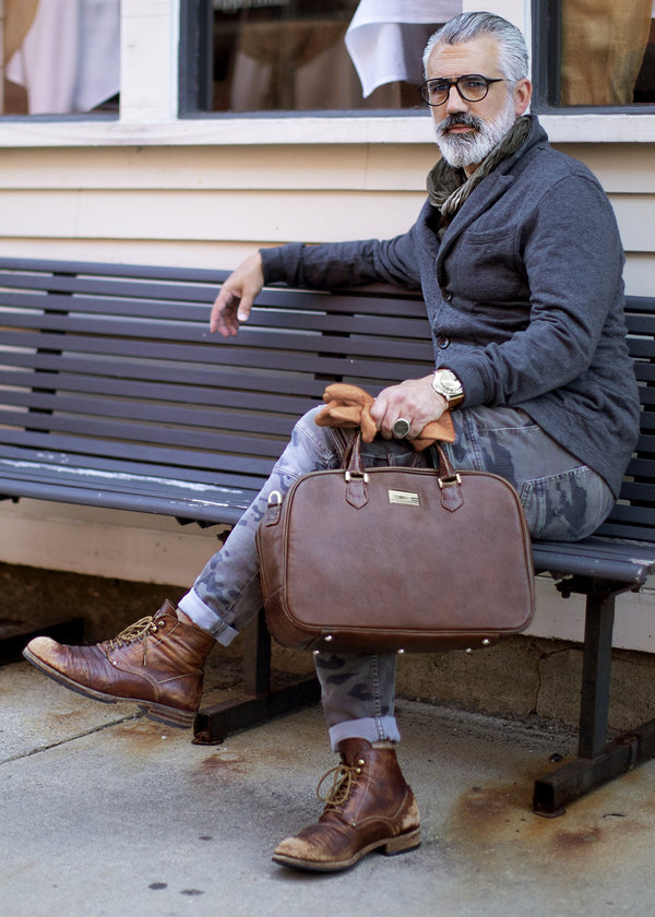 Man on bench with Newport Travel Satchel Bag in Brown Leather & Croc - Darby Scott