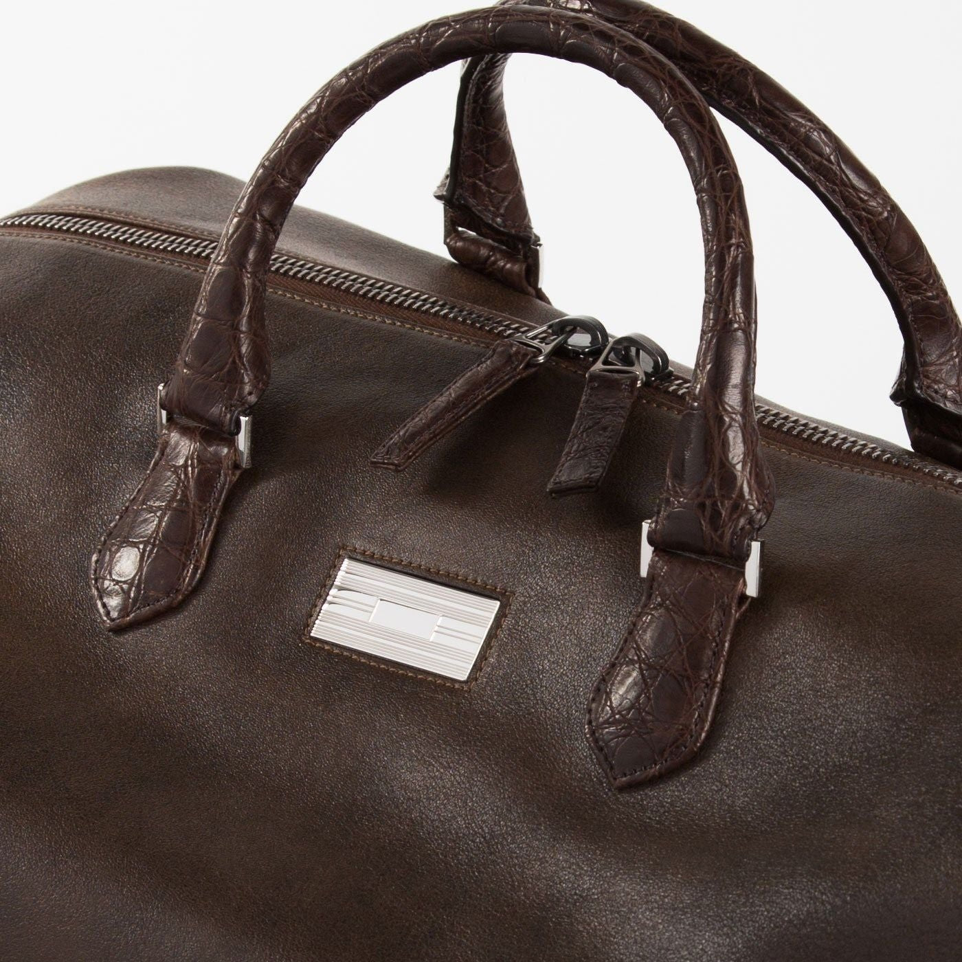 Close up of Sterling monogram plate Brown Aspen Travel Bag With Croc Trim - Darby Scott