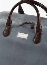 Close Up of Sterling Silver Monogram Plate on Aspen Travel Duffle Bag  - Darby Scott